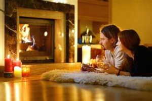 couple in front of fireplace